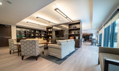 Bright communal living area with seating and decor