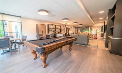 Interior view of a common area with a pool table