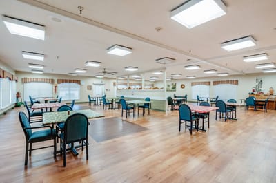 Bright dining area with tables and chairs