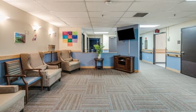 Bright common area with seating and artwork