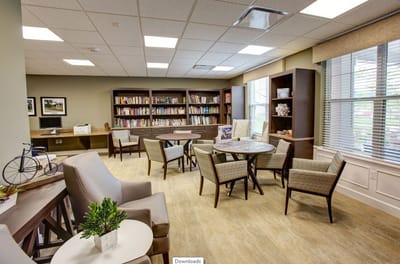Cozy common area with bookshelves and seating