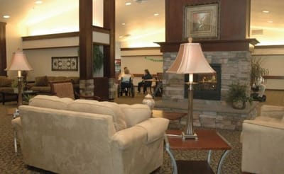 Modern lounge area with soft seating and fireplace