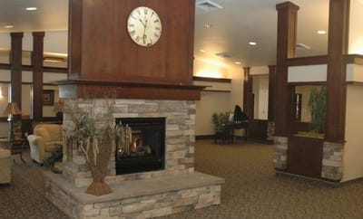 Interior view of a cozy common area with a fireplace
