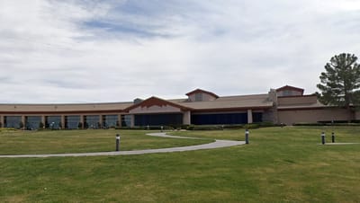 Exterior view of Sun City Anthem Center with landscaped grounds