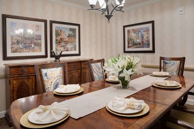 Elegant dining room setup with flowers and decor