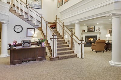 Bright and welcoming lobby with staircase and seating area