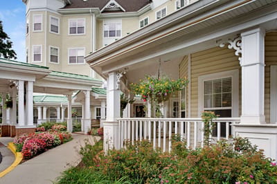 Beautifully landscaped entrance to a senior living facility