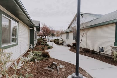 Pathway through a landscaped outdoor area of the facility