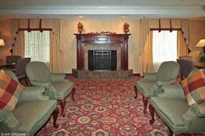 Cozy common area with seating and a fireplace