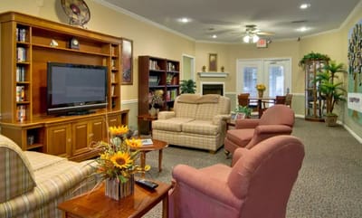 A cozy lounge area with seating and shelves