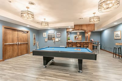 Interior view of a game room with a pool table