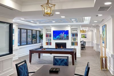 Common area with billiards table and aquarium