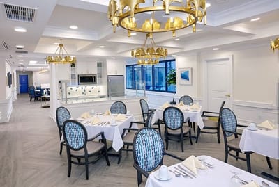 Bright dining room with elegant decor and tables set up