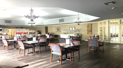 Interior view of dining area with tables and chairs