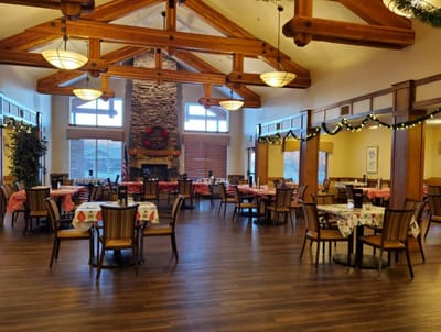 Bright dining room with wooden beams and tables