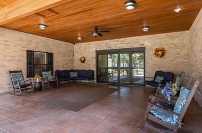 Common area with rocking chairs and flowers