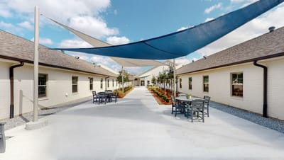 Outdoor courtyard with shaded seating area