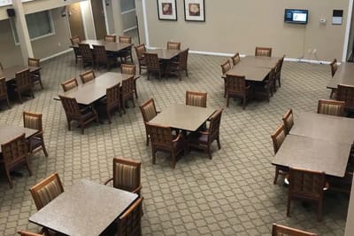 Dining area with tables and chairs in the background