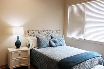 Cozy bedroom with a bed and lamp