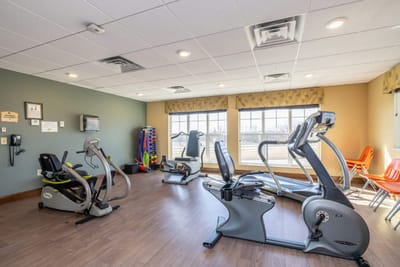 Well-equipped fitness room with exercise equipment