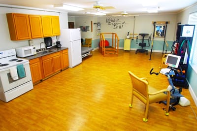 An interior activity room with equipment and seating