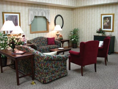 Cozy common area with sofas and decorative plants