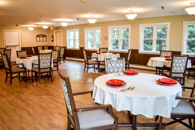 Bright dining room setup with tables and chairs