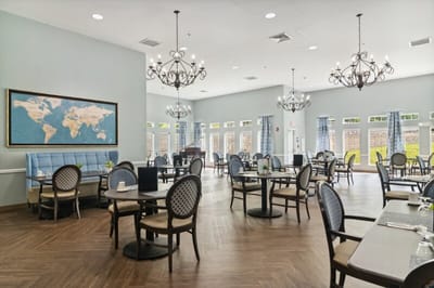 Dining room with tables and chairs in a well-lit space