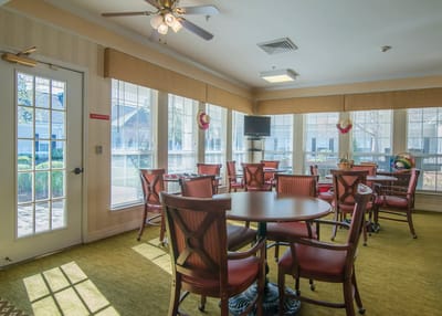 Common area with chairs and large windows
