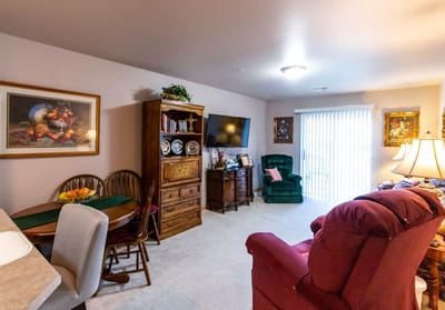 Cozy living room area with a dining table and chairs