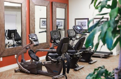 Well-equipped fitness room with exercise machines