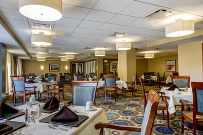 Elegant dining room setup with tables and chairs