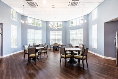 Bright common area with tables and chairs