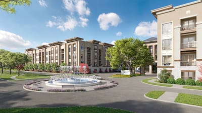 Exterior view of the facility with a fountain and gardens