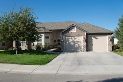 Exterior view of a residential building in a green landscape