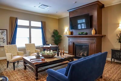 Comfortable common area with seating and a fireplace