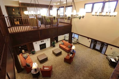 Interior view of a common area with seating and fireplace