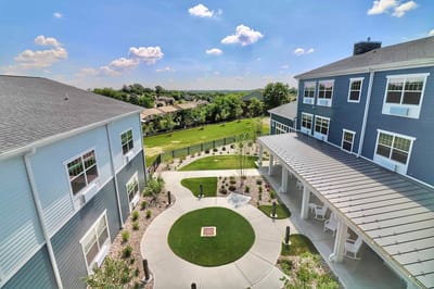 Aerial view of a landscaped courtyard in a senior living facility