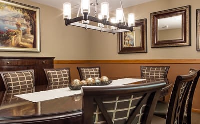 Elegant dining room with a large table and artwork