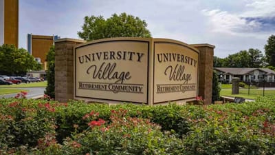 Entrance sign of University Village Retirement Community