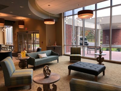 Bright common area with seating and natural light