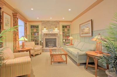Cozy common area with comfortable seating and a fireplace