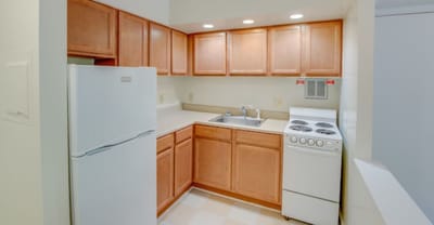 Well-lit kitchen area with appliances
