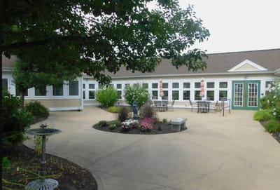 Outdoor courtyard with seating and floral arrangements