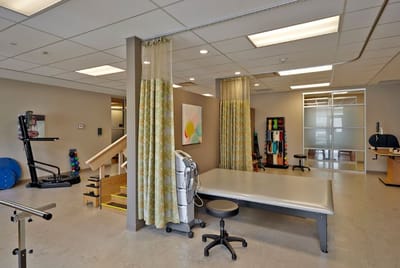 Interior view of a physical therapy area with equipment