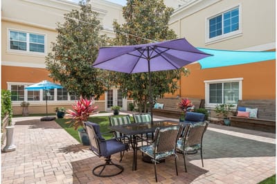Outdoor patio area with seating and umbrellas