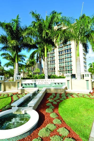 Exterior view of Westminster Palms with landscaping