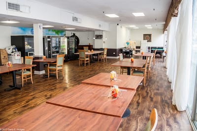 Dining area with wooden tables and chairs