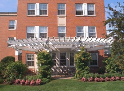Exterior view of a senior living facility with a patio
