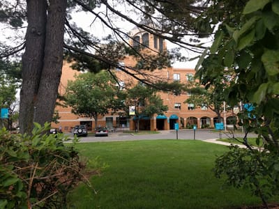 Exterior view of Youville House with gardens